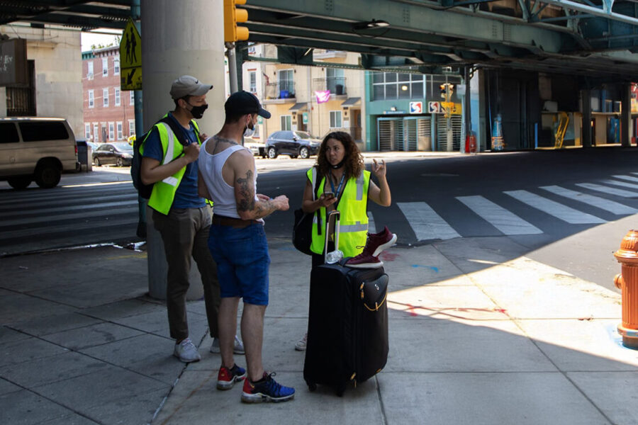 People helping man in kensington